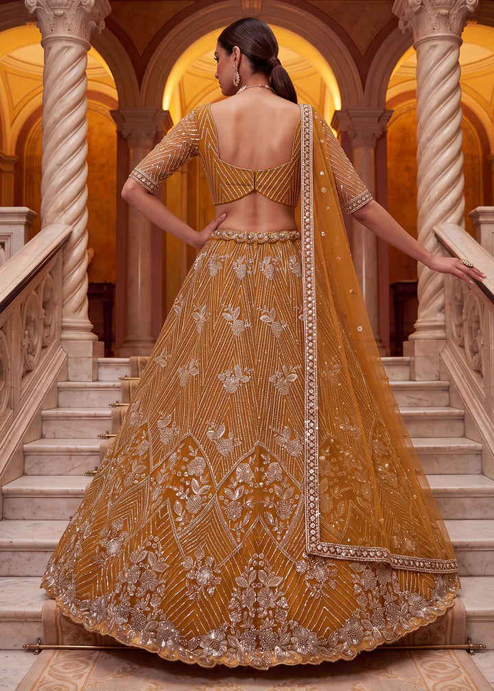 Shop Breathtaking Yellow Heavy Embroidery Reception Party Lehenga Choli Online in USA, UK, Canada, France, Germany, Spain, Austria, UAE &amp; Worldwide at Empress.