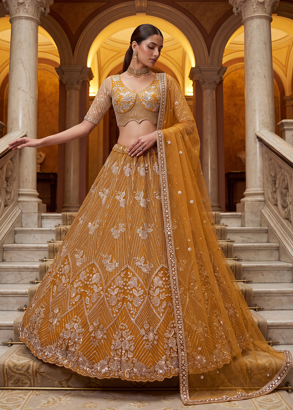 Shop Breathtaking Yellow Heavy Embroidery Reception Party Lehenga Choli Online in USA, UK, Canada, France, Germany, Spain, Austria, UAE &amp; Worldwide at Empress.