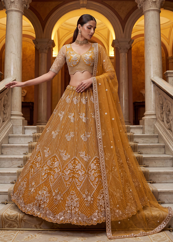 Shop Breathtaking Yellow Heavy Embroidery Reception Party Lehenga Choli Online in USA, UK, Canada, France, Germany, Spain, Austria, UAE &amp; Worldwide at Empress.