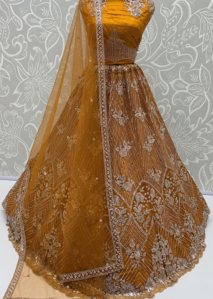 Shop Breathtaking Yellow Heavy Embroidery Reception Party Lehenga Choli Online in USA, UK, Canada, France, Germany, Spain, Austria, UAE &amp; Worldwide at Empress.