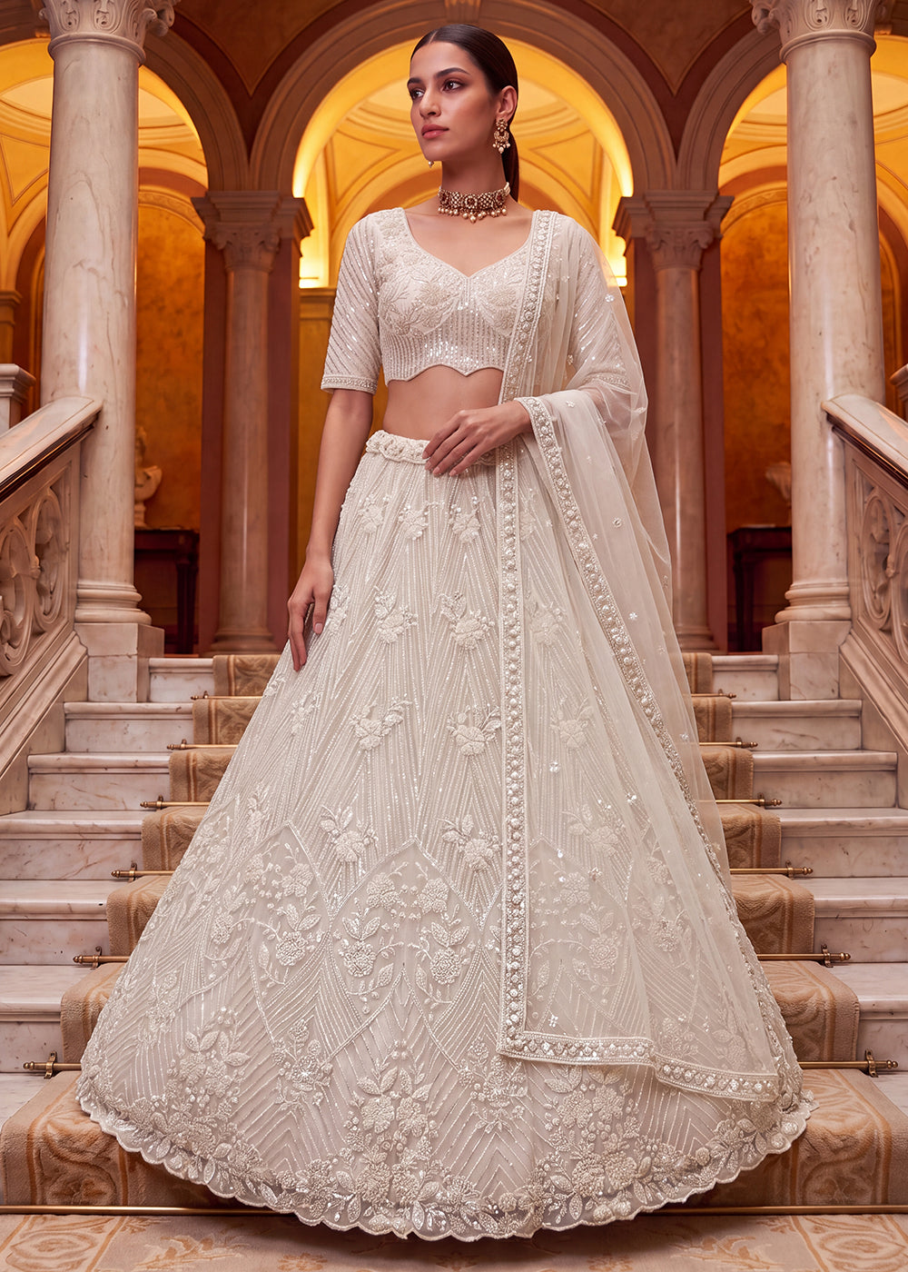 Shop Breathtaking White Heavy Embroidery Reception Party Lehenga Choli Online in USA, UK, Canada, France, Germany, Spain, Austria, UAE & Worldwide at Empress.