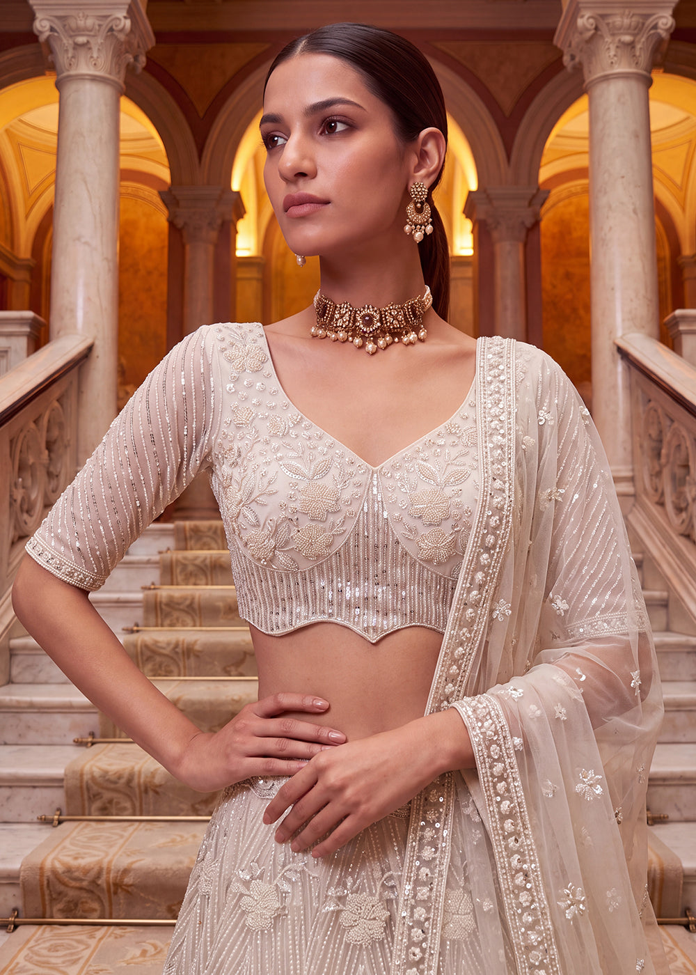 Shop Breathtaking White Heavy Embroidery Reception Party Lehenga Choli Online in USA, UK, Canada, France, Germany, Spain, Austria, UAE & Worldwide at Empress.