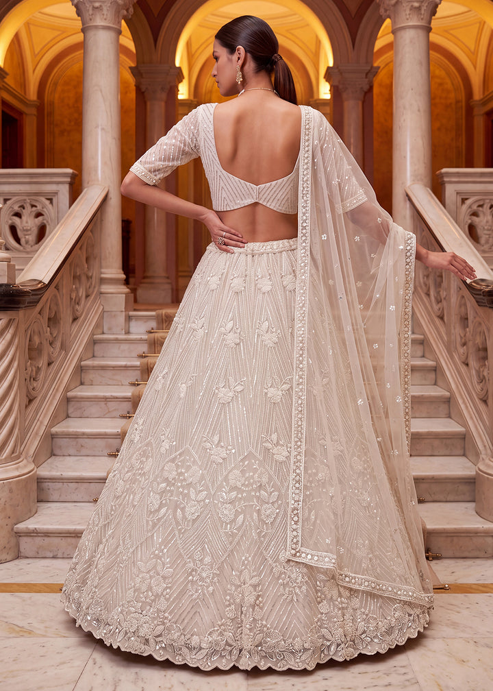 Shop Breathtaking White Heavy Embroidery Reception Party Lehenga Choli Online in USA, UK, Canada, France, Germany, Spain, Austria, UAE &amp; Worldwide at Empress.