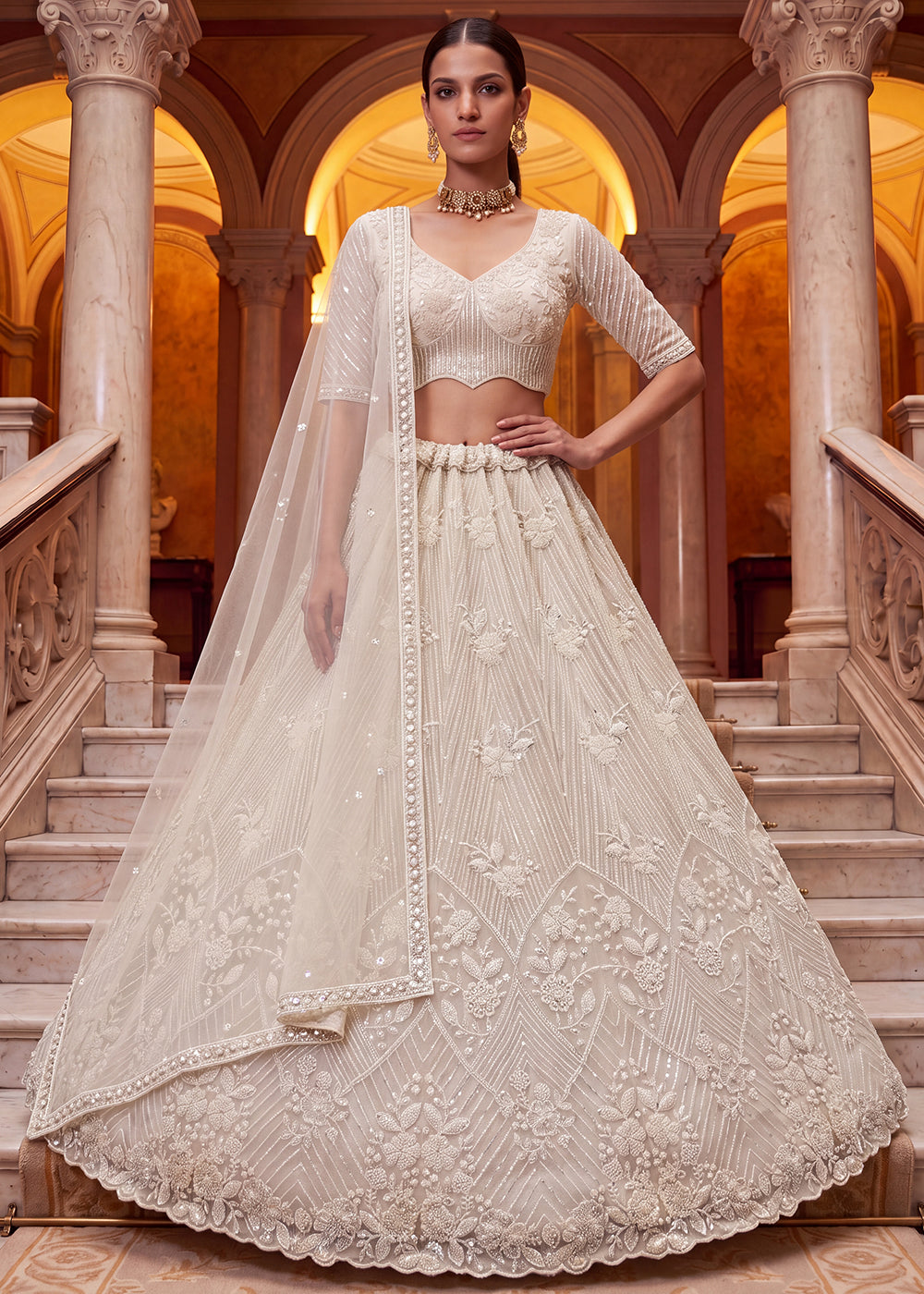 Shop Breathtaking White Heavy Embroidery Reception Party Lehenga Choli Online in USA, UK, Canada, France, Germany, Spain, Austria, UAE &amp; Worldwide at Empress.