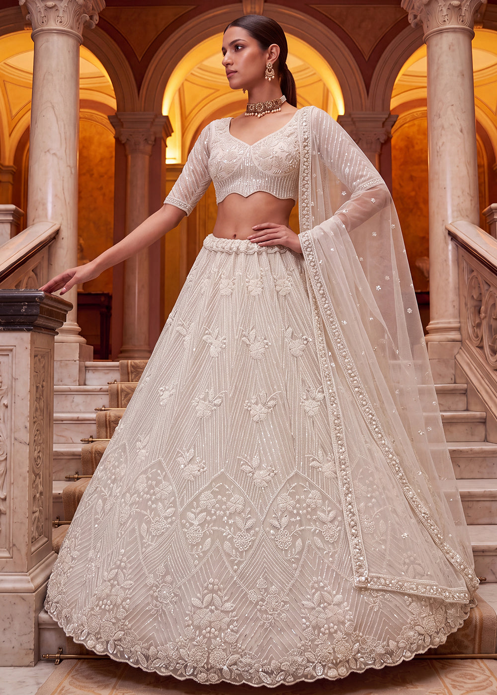 Shop Breathtaking White Heavy Embroidery Reception Party Lehenga Choli Online in USA, UK, Canada, France, Germany, Spain, Austria, UAE &amp; Worldwide at Empress.