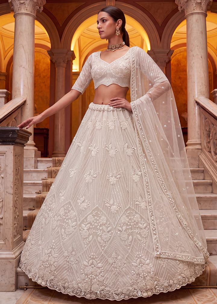 Shop Breathtaking White Heavy Embroidery Reception Party Lehenga Choli Online in USA, UK, Canada, France, Germany, Spain, Austria, UAE &amp; Worldwide at Empress.