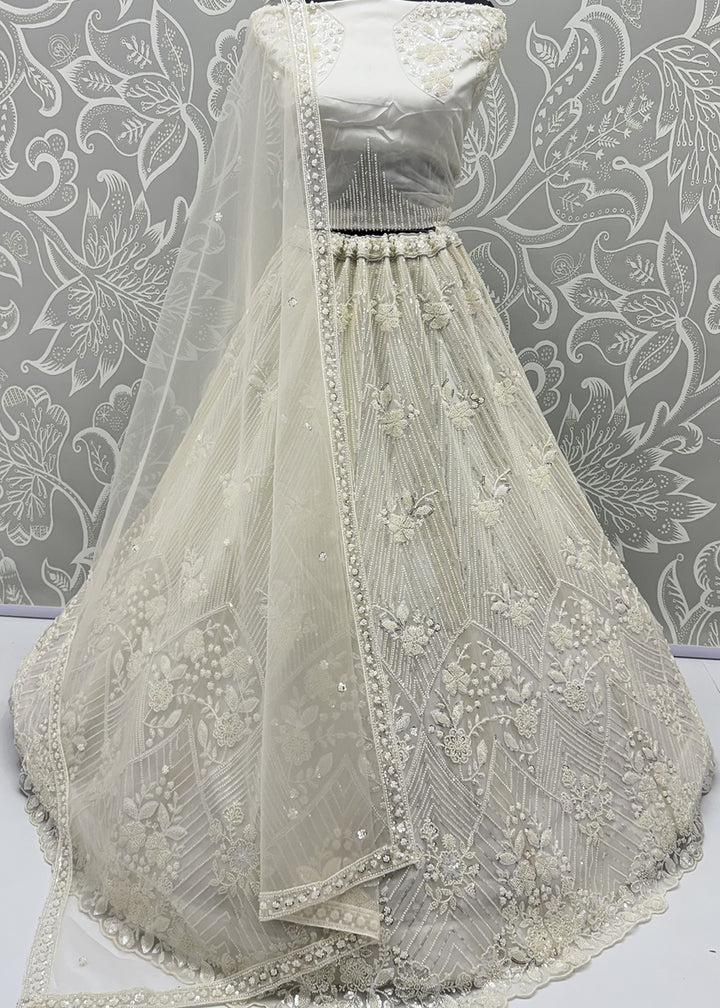 Shop Breathtaking White Heavy Embroidery Reception Party Lehenga Choli Online in USA, UK, Canada, France, Germany, Spain, Austria, UAE &amp; Worldwide at Empress.