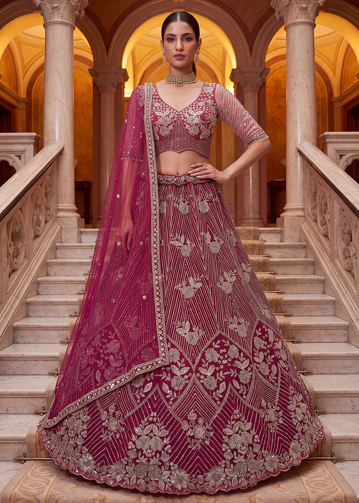 Shop Breathtaking Pink Heavy Embroidery Reception Party Lehenga Choli Online in USA, UK, Canada, France, Germany, Spain, Austria, UAE &amp; Worldwide at Empress.