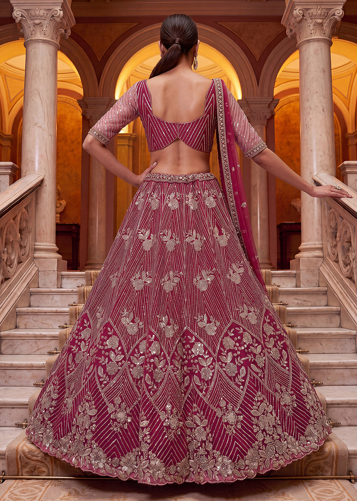 Shop Breathtaking Pink Heavy Embroidery Reception Party Lehenga Choli Online in USA, UK, Canada, France, Germany, Spain, Austria, UAE &amp; Worldwide at Empress.