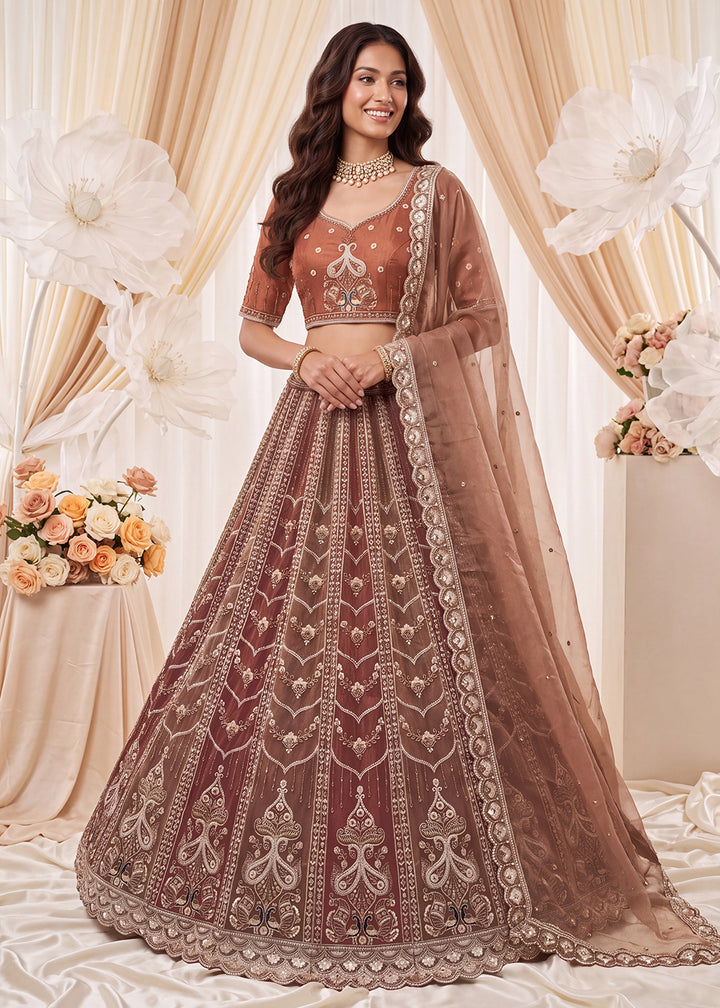 Shop Now Fascinating Shaded Rust Silk Wedding Party Lehenga Choli Online in USA, UK, Canada, France, Germany, Spain, Austria, Australia &amp; Worldwide at Empress.