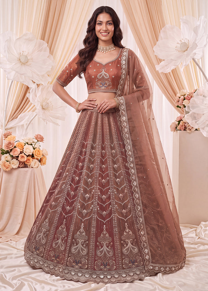 Shop Now Fascinating Shaded Rust Silk Wedding Party Lehenga Choli Online in USA, UK, Canada, France, Germany, Spain, Austria, Australia &amp; Worldwide at Empress.