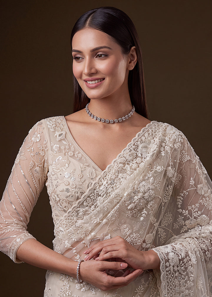 Buy Now Cream Elegant Floral Thread Embroidery Indian Wedding Saree Online in US, UK, Canada, France, Germany, Denmark, Sweden, Austria &amp; Worldwide at Empress.