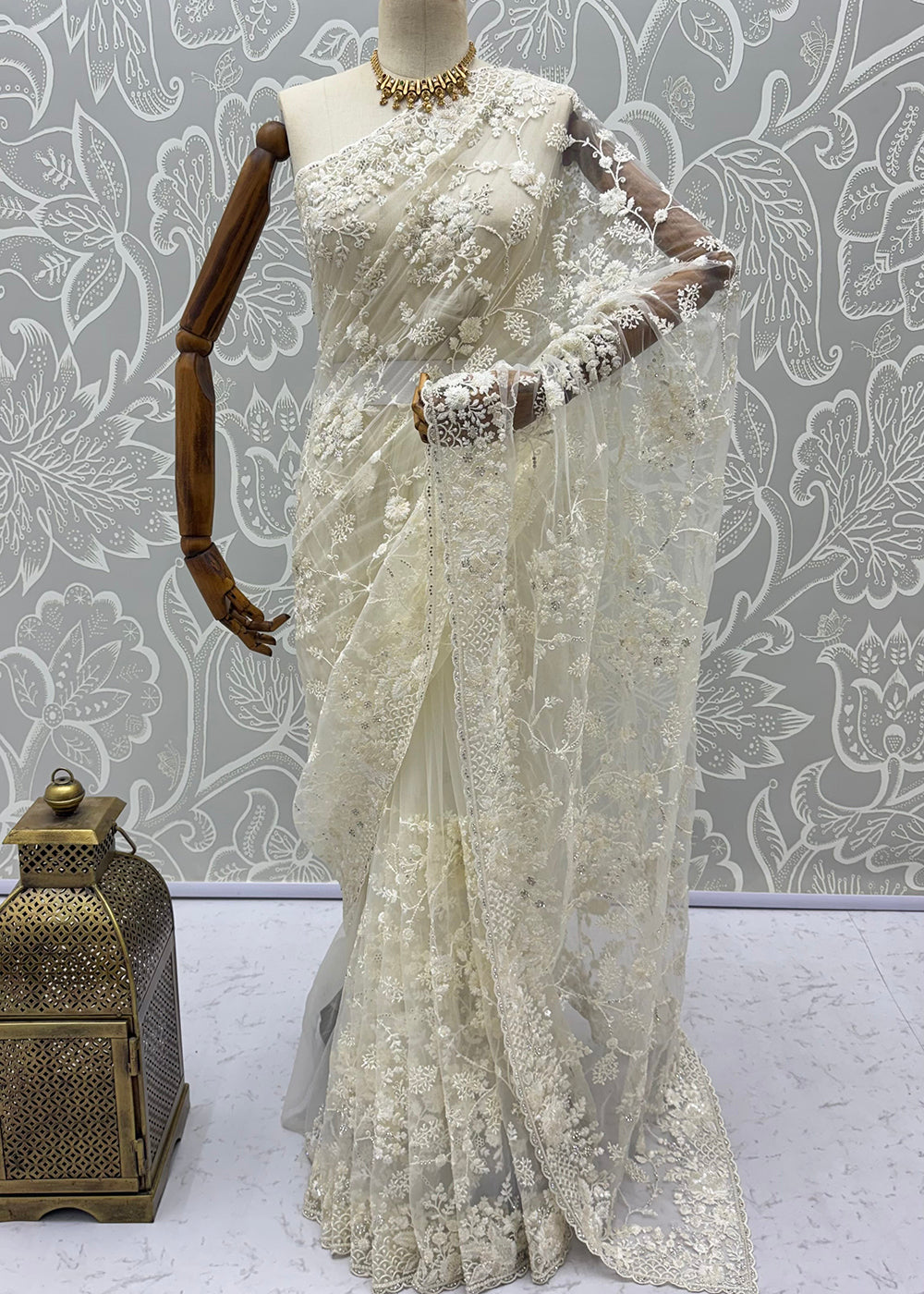 Buy Now Cream Elegant Floral Thread Embroidery Indian Wedding Saree Online in US, UK, Canada, France, Germany, Denmark, Sweden, Austria &amp; Worldwide at Empress.