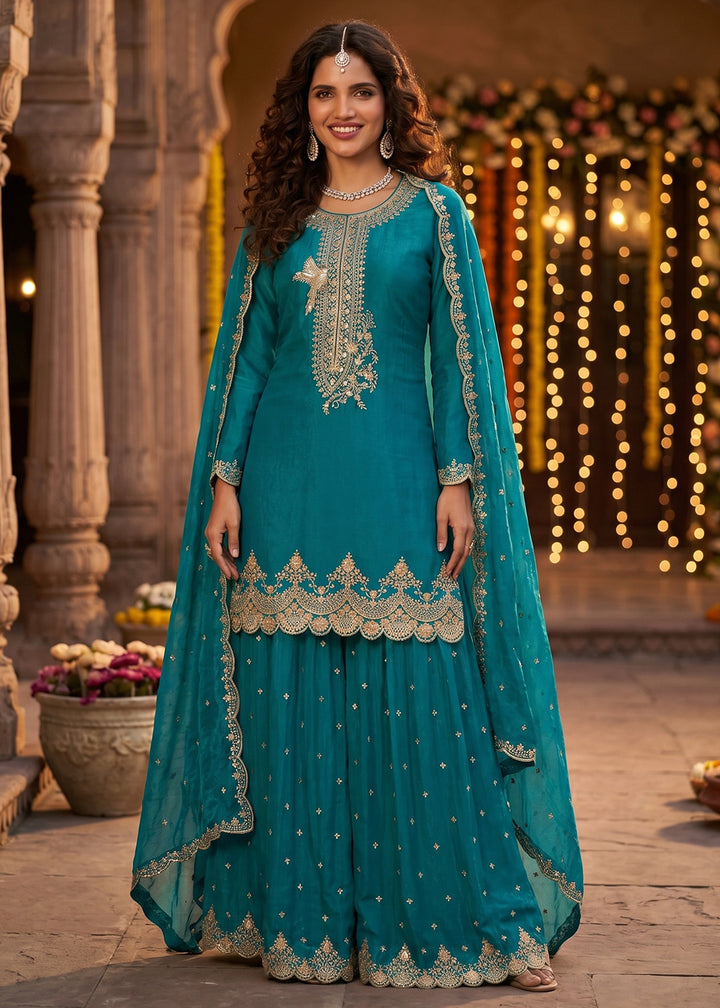Buy Now Peacock Blue Tora Silk Embroidered Festive Palazzo Style Dress Online in US, UK, Canada, Netherlands, Germany, Italy, France, UAE & Worldwide at Empress.
