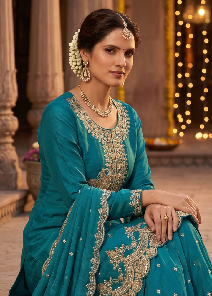 Buy Now Peacock Blue Tora Silk Embroidered Festive Palazzo Style Dress Online in US, UK, Canada, Netherlands, Germany, Italy, France, UAE & Worldwide at Empress.