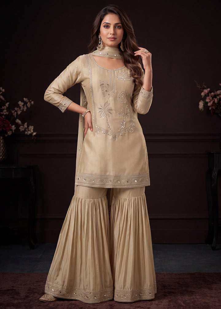 Shop Now Beige Satin Silk Embroidered Gharara Style Dress Online at Empress in US, UK, Canada, Italy, Germany, France, Greece, Sweden, Denmark &amp; Worldwide.