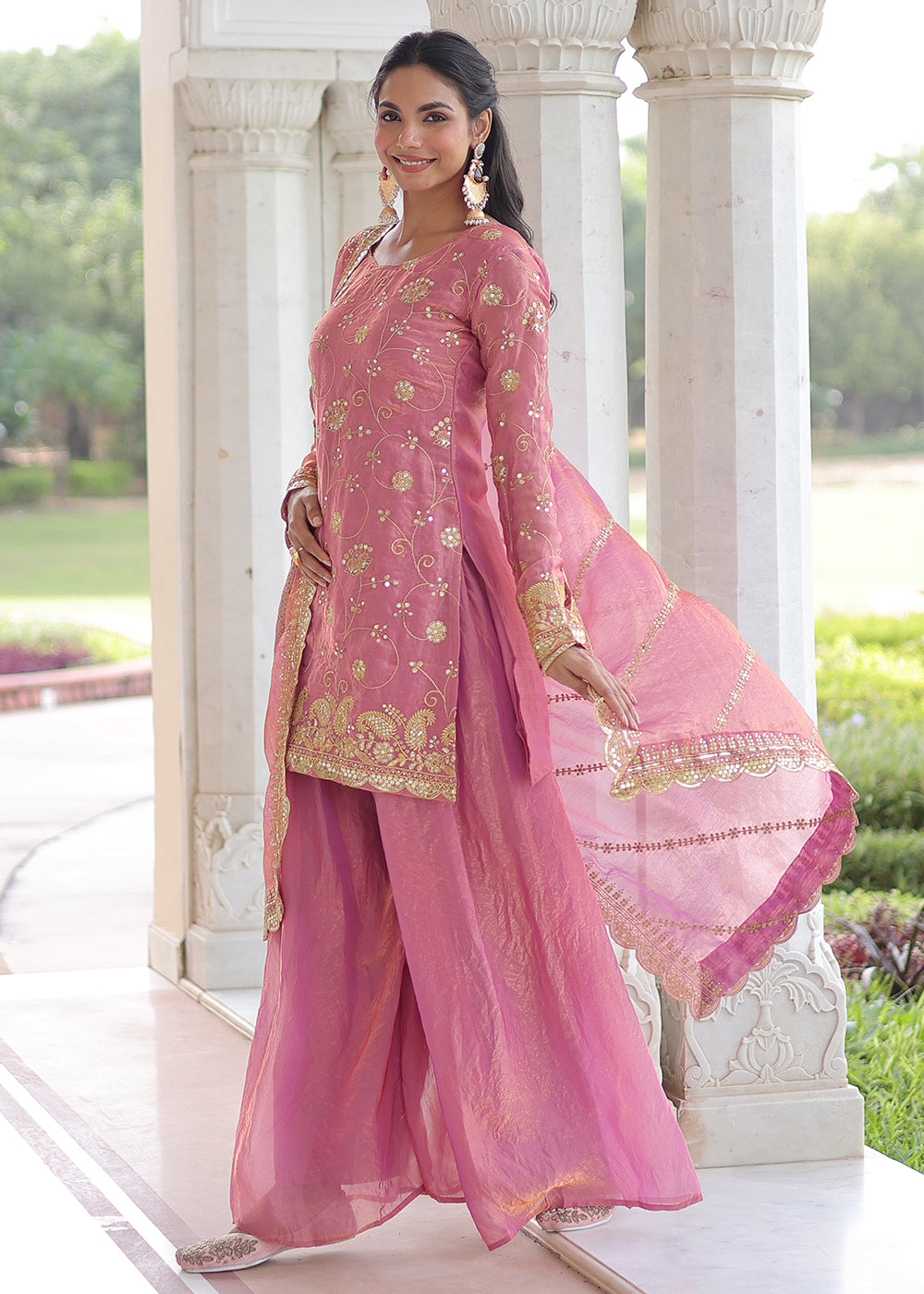Shop Now Pink Fendy Silk Rich Sequins Sharara Suit Online at Empress in US, UK, Canada, Germany, Australia, Sweden, Denmark, UAE, Qatar, Africa & Worldwide.