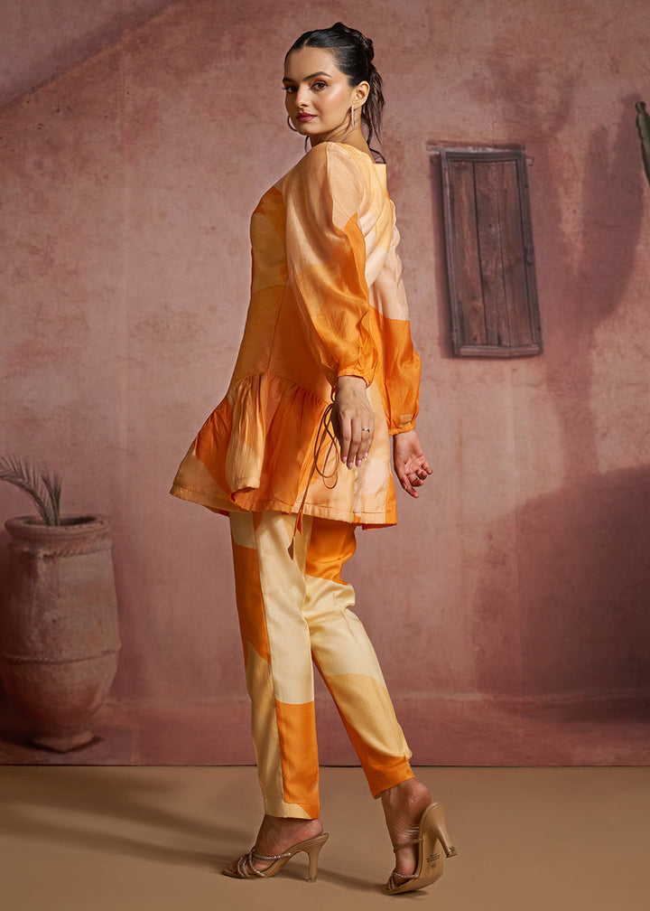 Buy Now Orange Abstract Printed Peplum Tunic &amp; Trouser Co-Ord Set Online in US, UK, Canada, Netherlands, Germany, Italy, France, Greece &amp; Worldwide at Empress.