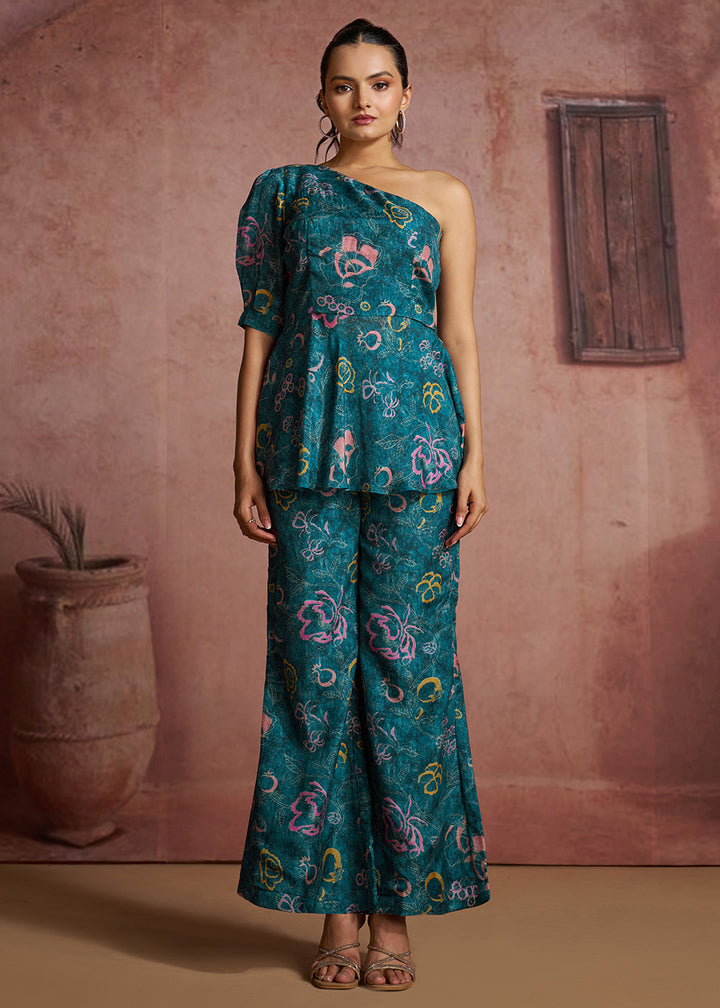 Buy Now Blue Floral Printed One-Shoulder Peplum Top &amp; Trouser Co-Ord Set Online in US, UK, Canada, Netherlands, Germany, Italy, France &amp; Worldwide at Empress.