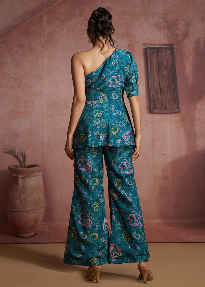 Buy Now Blue Floral Printed One-Shoulder Peplum Top &amp; Trouser Co-Ord Set Online in US, UK, Canada, Netherlands, Germany, Italy, France &amp; Worldwide at Empress.