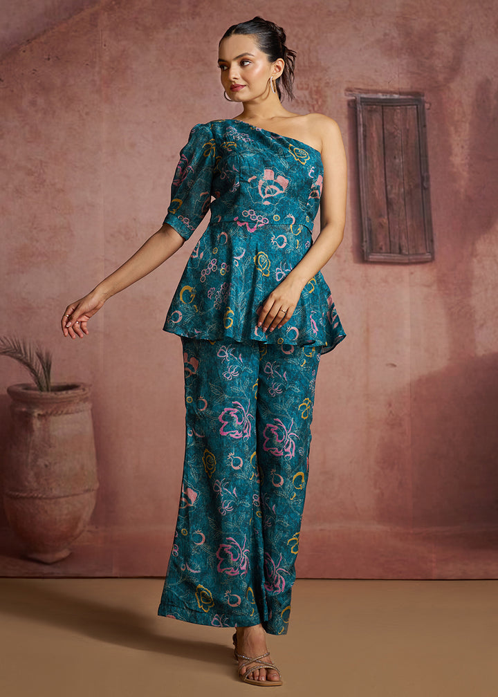 Buy Now Blue Floral Printed One-Shoulder Peplum Top &amp; Trouser Co-Ord Set Online in US, UK, Canada, Netherlands, Germany, Italy, France &amp; Worldwide at Empress.