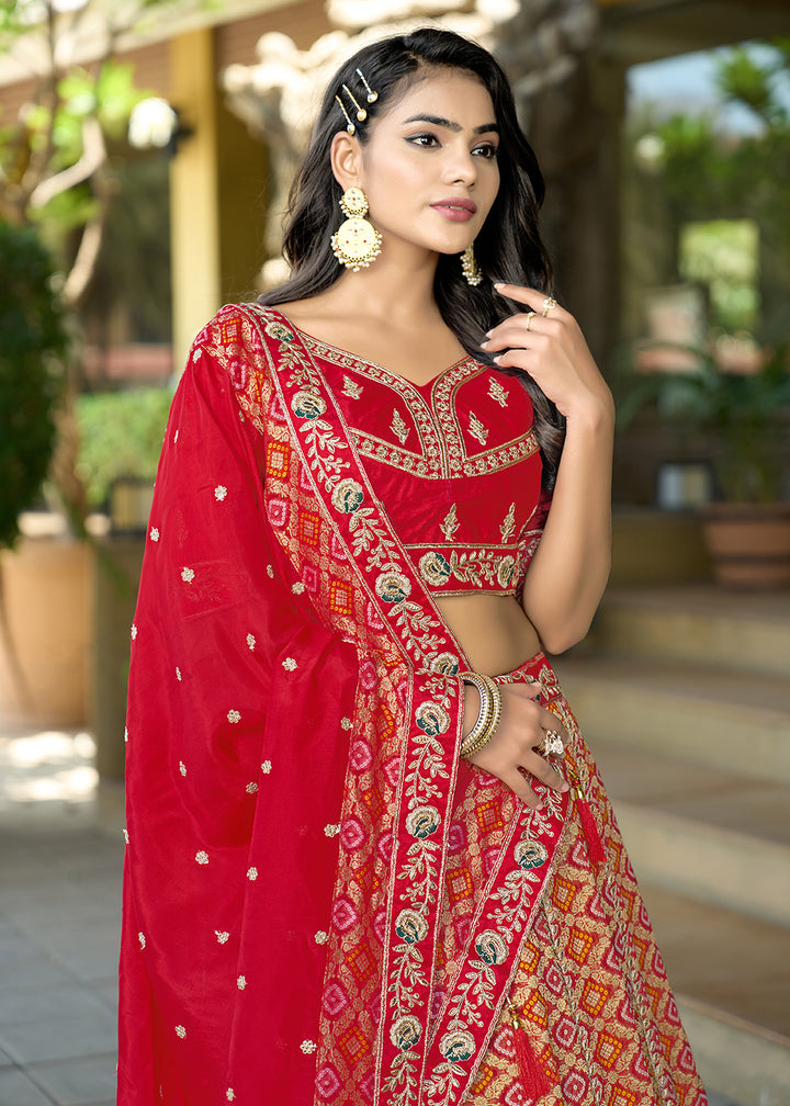 Buy Now Red Heavy Embroidered Wedding Designer Lehenga Choli Online in USA, UK, Canada, France, Italy, Germany, Australia, UAE & Worldwide at Empress Clothing.