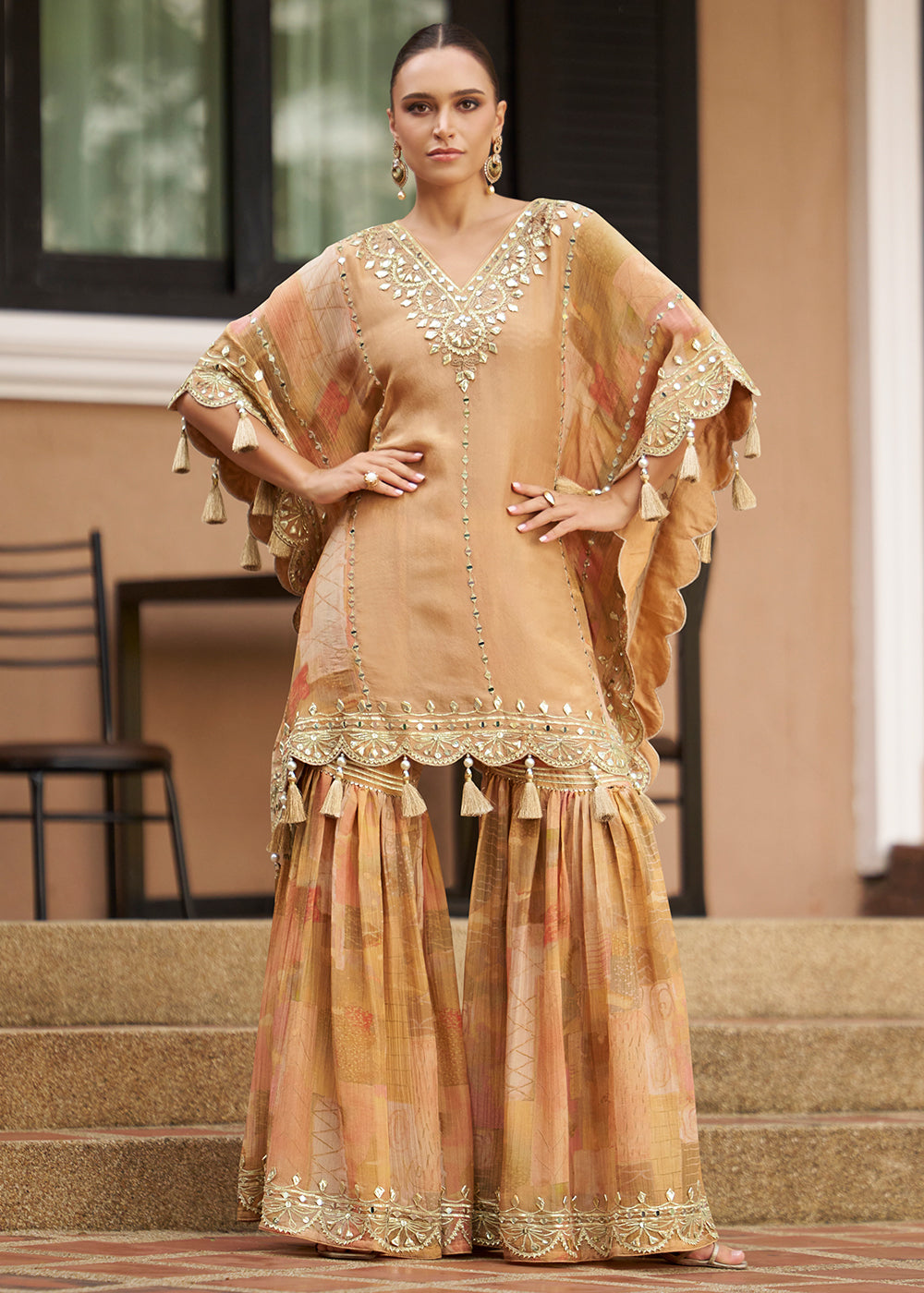 Buy Now Peach Embroidered Kaftan Style Trendy Gharara Suit Online in USA, UK, Canada, Germany, Italy, France, Austria, Denmark, UAE & Worldwide at Empress.