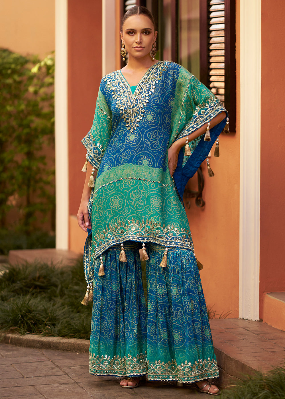 Buy Now Blue Embroidered Kaftan Style Trendy Gharara Suit Online in USA, UK, Canada, Germany, Italy, France, Austria, Denmark, UAE & Worldwide at Empress.