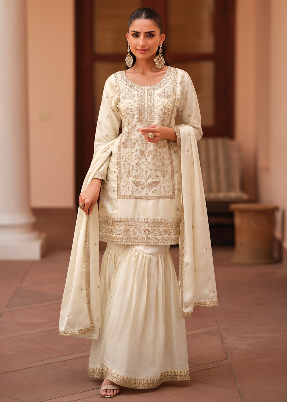 Shop Now Off White Silk Satin Embroidered Gharara Style Suit Online at Empress in USA, UK, Canada, Germany, Australia, Sweden, Denmark, UAE, Qatar & Worldwide.