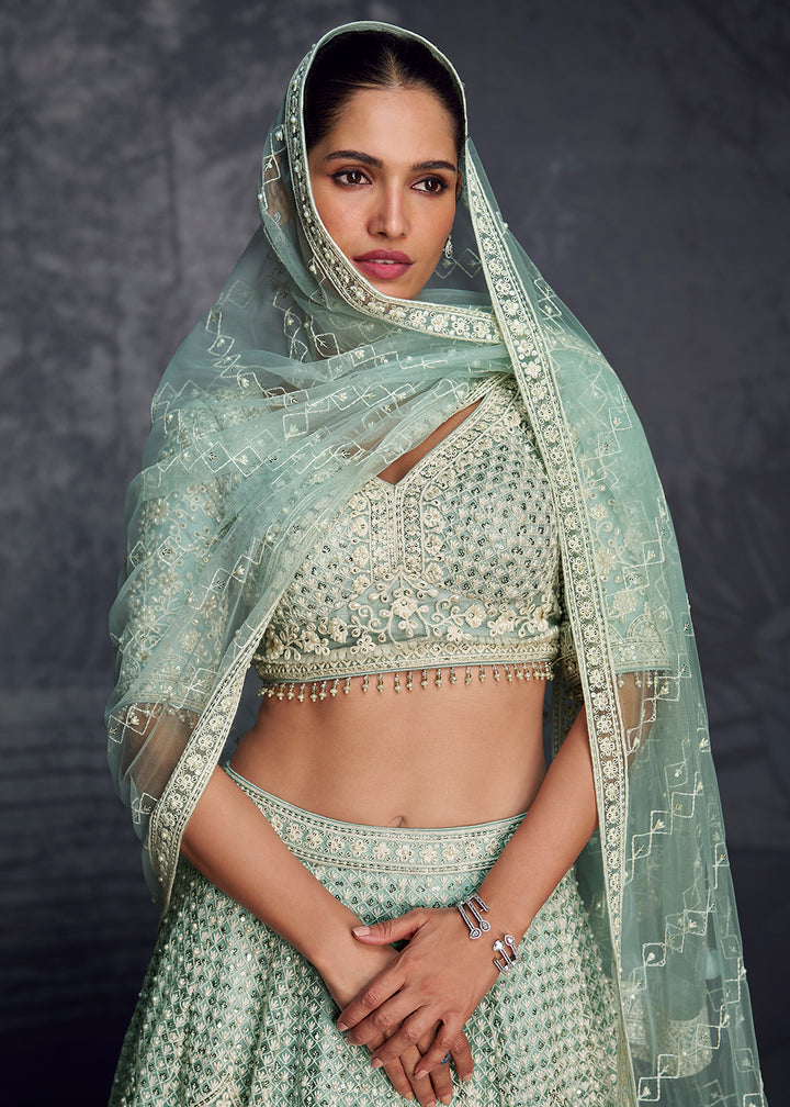 Buy Now Sea Green Net Hand Embroidered Designer Lehenga Choli Online in USA, UK, Canada, France & Worldwide at Empress Clothing. 