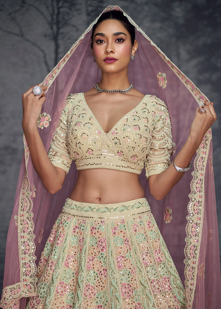 Buy Now Ivory Pink Net Hand Embroidered Designer Lehenga Choli Online in USA, UK, Canada, France & Worldwide at Empress Clothing.