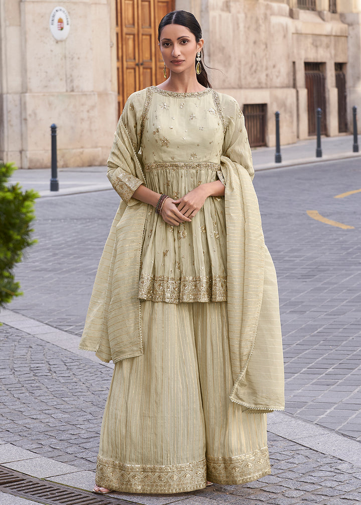 Shop Now Creamy Beige Shimmer Silk Embroidered Sharara Style Suit Online in USA, UK, Canada, France, Qatar, Germany, Italy, UAE & Worldwide at Empress Clothing.