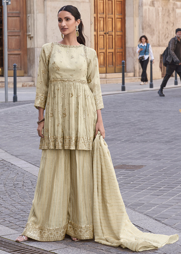 Shop Now Creamy Beige Shimmer Silk Embroidered Sharara Style Suit Online in USA, UK, Canada, France, Qatar, Germany, Italy, UAE & Worldwide at Empress Clothing.