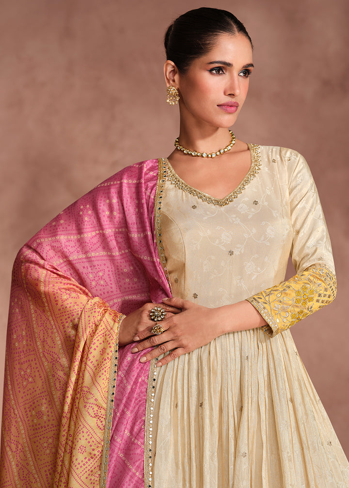 Buy Now Beige & Yellow Embroidered Anarkali Gown with Bandhani Dupatta Online in USA, UK, Australia, Italy, Germany, Canada, UAE & Worldwide at Empress Clothing. 