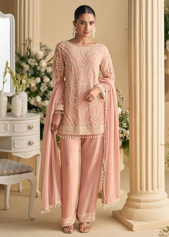 Buy Now Blush Peach Georgette Chikankari Pant Style Suit Online in US, UK, Canada, Germany, Italy, France, Austria, Denmark, UAE & Worldwide at Empress Clothing.