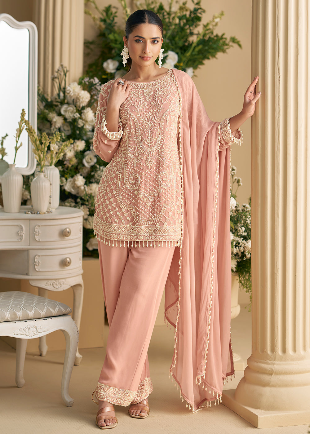 Buy Now Blush Peach Georgette Chikankari Pant Style Suit Online in US, UK, Canada, Germany, Italy, France, Austria, Denmark, UAE & Worldwide at Empress Clothing.
