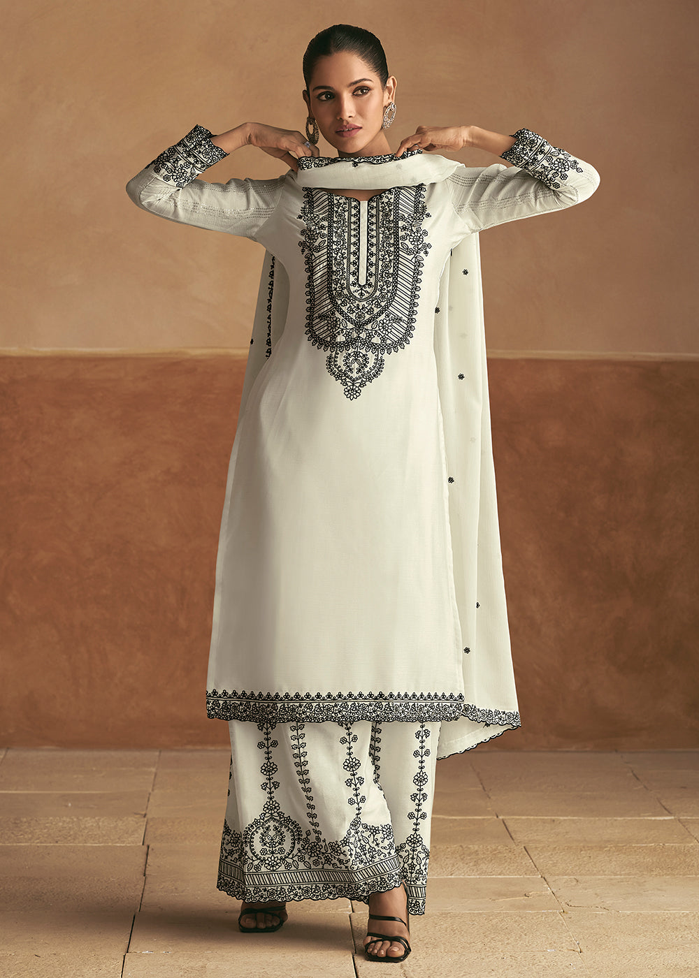 Buy Now Embroidered White Real Chinnon Palazzo Style Suit Online in USA, UK, Canada, Germany, Dubai & Worldwide at Empress Clothing. 