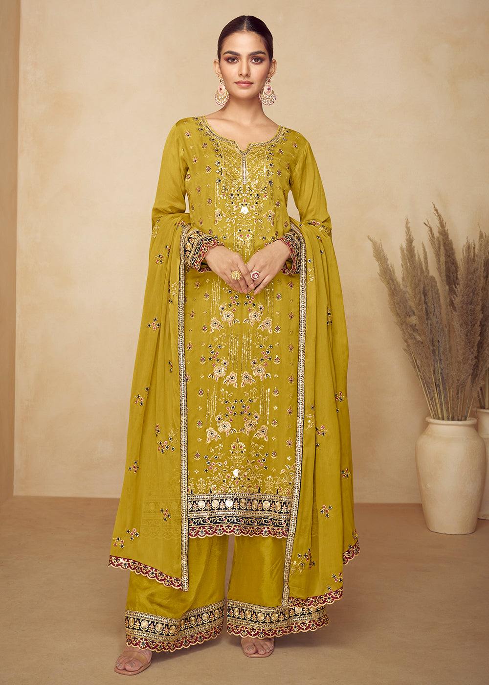 Buy Now Chinnon Yellow Hand Embroidered Festive Palazzo Suit Online in US, UK, Canada, Germany, Italy, France, Austria, Netherlands, UAE & Worldwide at Empress.