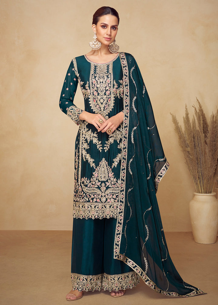 Buy Now Chinnon Teal Hand Embroidered Festive Palazzo Suit Online in US, UK, Canada, Germany, Italy, France, Austria, Netherlands, UAE & Worldwide at Empress.