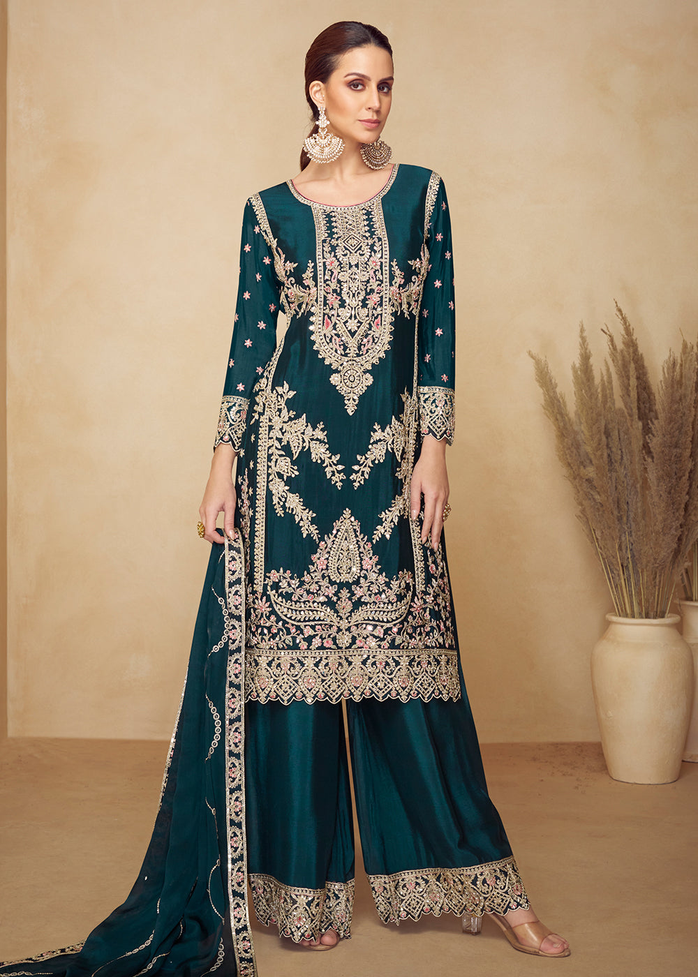 Buy Now Chinnon Teal Hand Embroidered Festive Palazzo Suit Online in US, UK, Canada, Germany, Italy, France, Austria, Netherlands, UAE & Worldwide at Empress.