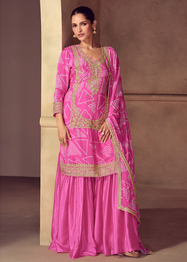 Shop Now Premium Pink Embroidered Festive Gharara Style Suit Online in USA, UK, Canada, France, Qatar, Germany, Italy, Spain & Worldwide at Empress Clothing.