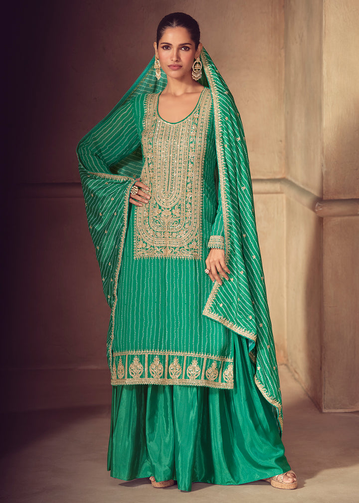 Shop Now Premium Green Embroidered Festive Sharara Style Suit Online in USA, UK, Canada, France, Qatar, Germany, Italy, Spain & Worldwide at Empress Clothing.