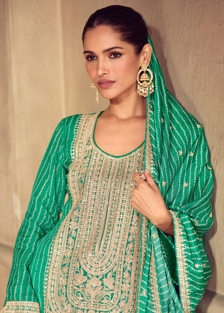 Shop Now Premium Green Embroidered Festive Sharara Style Suit Online in USA, UK, Canada, France, Qatar, Germany, Italy, Spain & Worldwide at Empress Clothing.