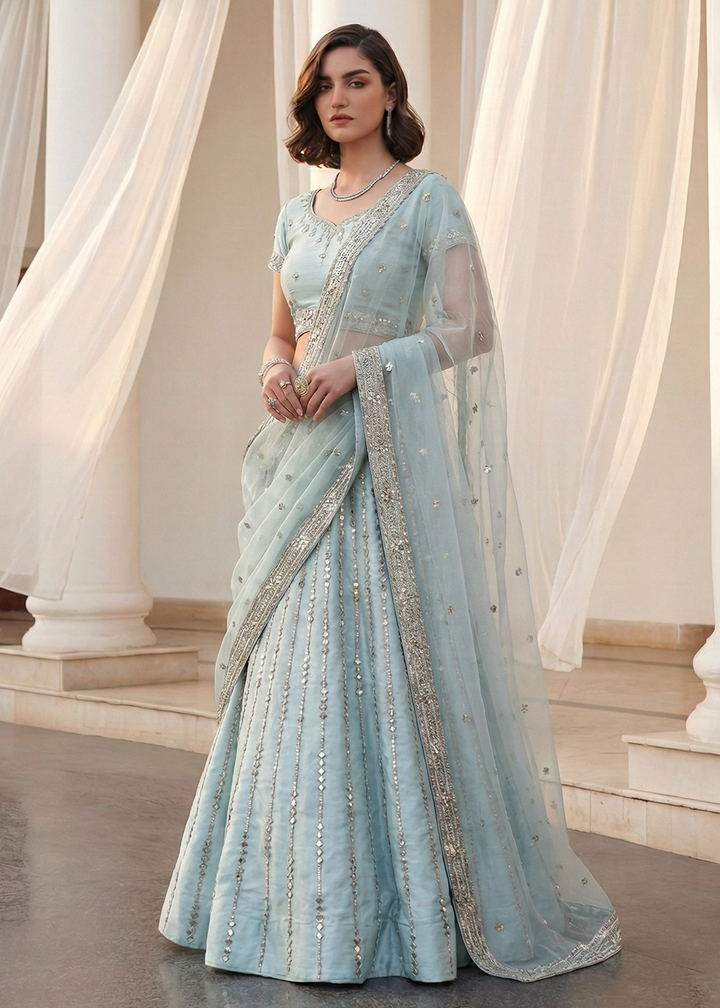 Buy Now Mirror Work Pastel Blue Wedding Wear Lehenga Online in US, UK, Canada, France, Germany, Sweden, Greece, Denmark, Spain, Africa & Worldwide at Empress.