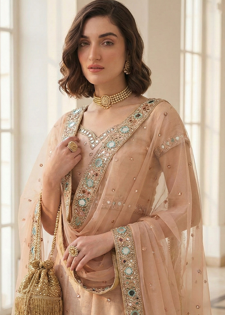 Buy Now Mirror Work Pastel Peach Wedding Wear Lehenga Online in US, UK, Canada, France, Germany, Sweden, Greece, Denmark, Spain, Africa & Worldwide at Empress.