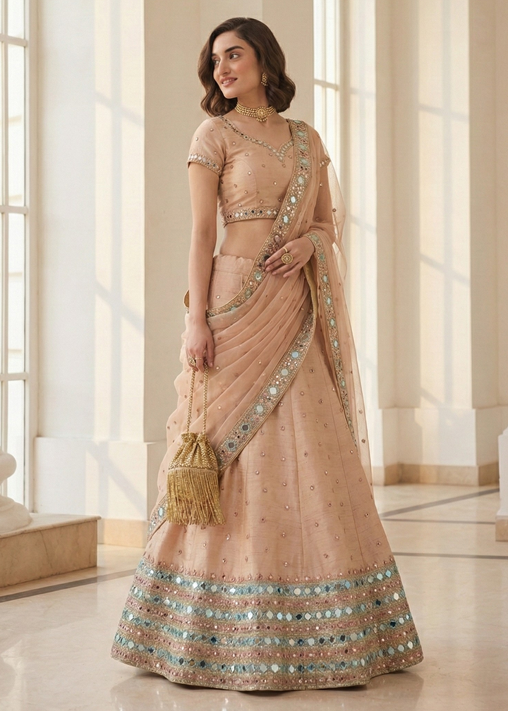 Buy Now Mirror Work Pastel Peach Wedding Wear Lehenga Online in US, UK, Canada, France, Germany, Sweden, Greece, Denmark, Spain, Africa & Worldwide at Empress.