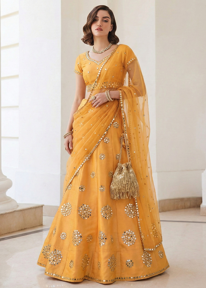 Buy Now Mirror Work Pastel Yellow Wedding Wear Lehenga Online in US, UK, Canada, France, Germany, Sweden, Greece, Denmark, Spain, Africa & Worldwide at Empress.