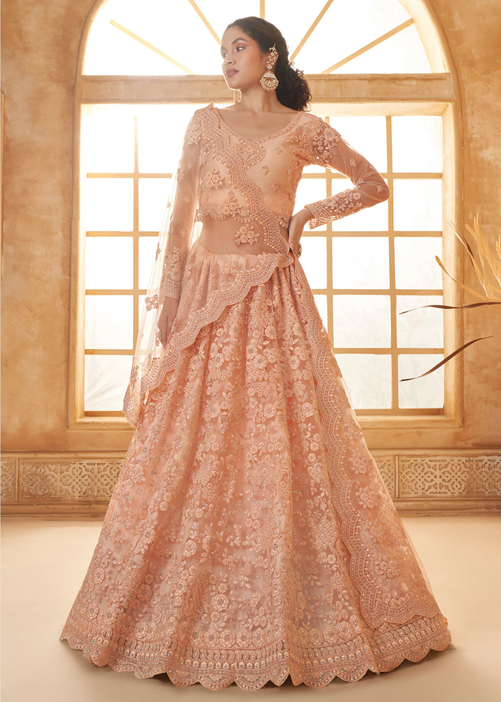 Buy Now Adorable Peach Heavy Net Embroidered Bridal Lehenga Choli Online in USA, UK, France, UAE & Worldwide at Empress Clothing.