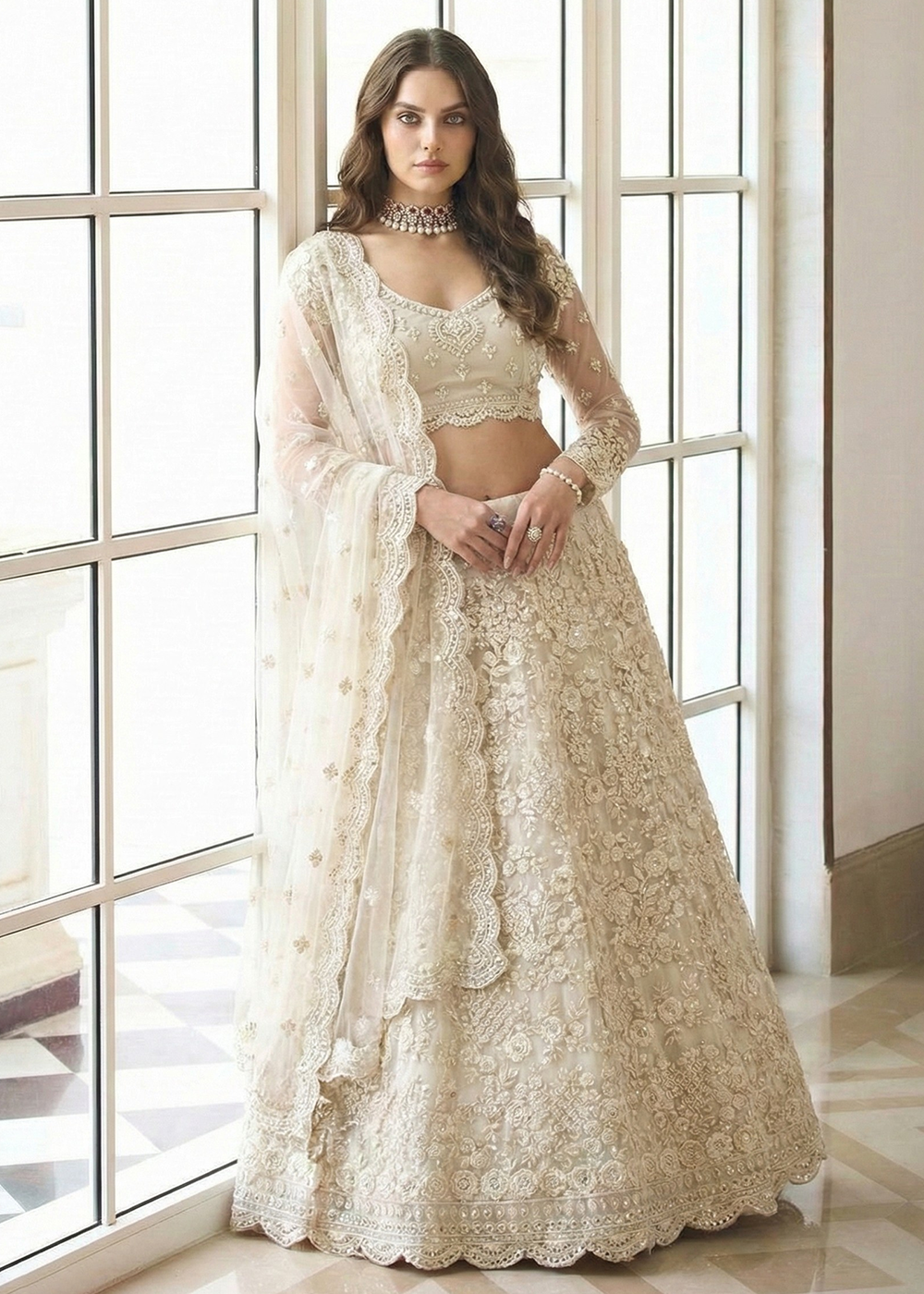Buy Now Adorable Cream Heavy Net Embroidered Bridal Lehenga Choli Online in USA, UK, France, Swiss, Netherlands, Germany, Italy, Qatar & Worldwide at Empress.