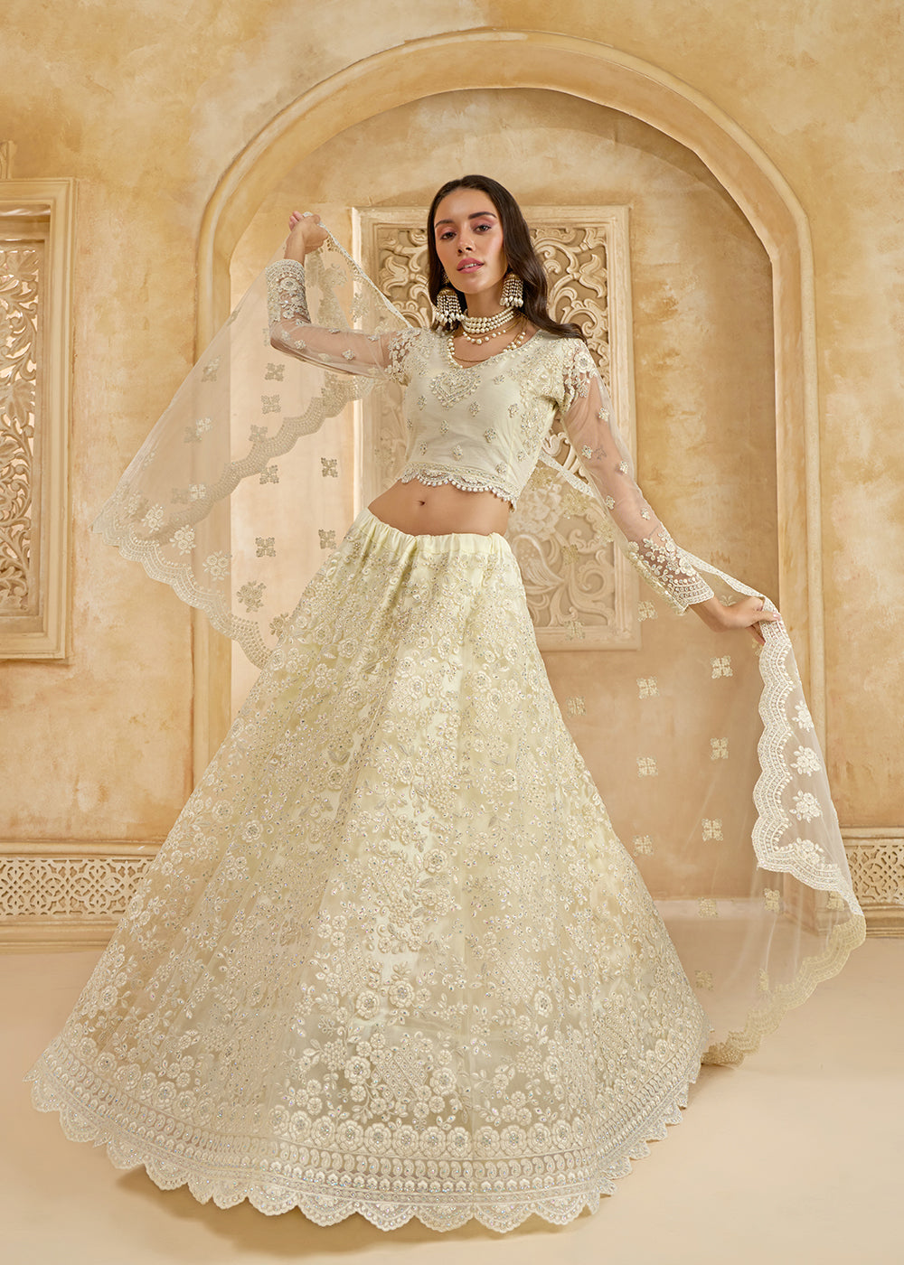 Buy Now Adorable Cream Heavy Net Embroidered Bridal Lehenga Choli Online in USA, UK, France, UAE & Worldwide at Empress Clothing. 